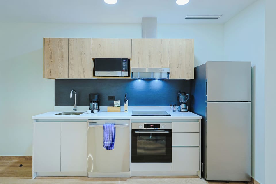 Your fully-equipped kitchen has everything you need to prepare meals during your stay, with modern appliances and sleek countertops making cooking a breeze.