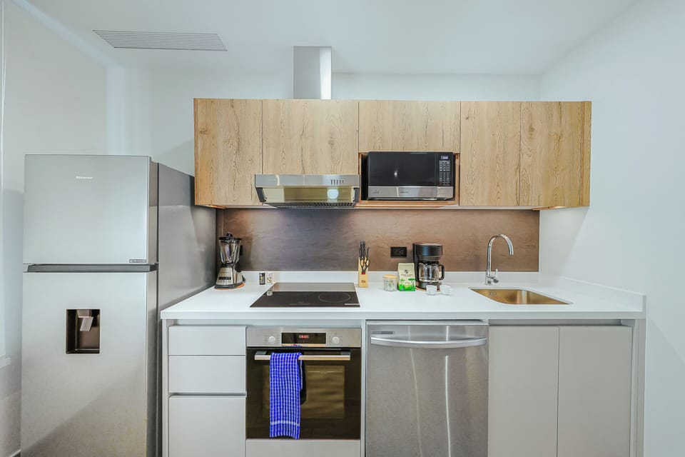Your fully equipped kitchen invites you to whip up fresh meals with modern appliances and ample counter space, making it easy to feel at home during your stay.