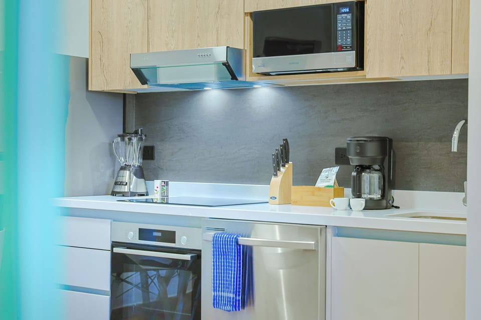 Your fully equipped kitchen features modern stainless steel appliances, sleek countertops, and everything you need to whip up delicious meals during your stay.