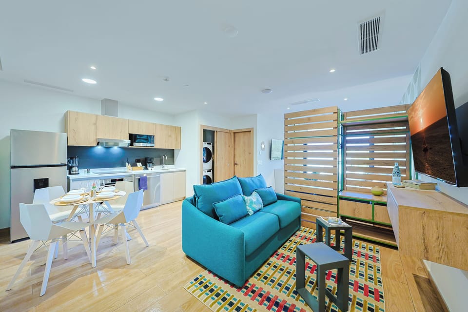 Picture yourself here in this bright, open-concept space where you can cook, dine, and relax—all in one beautifully designed room. A stylish hideaway blends modern comfort with coastal vibes.