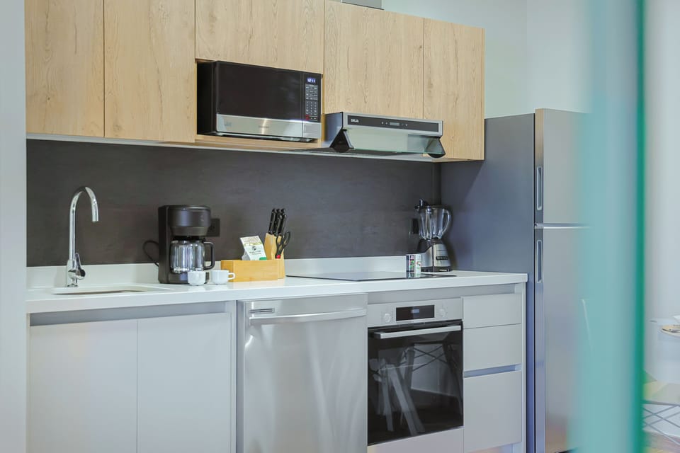 Your fully-equipped kitchen awaits with modern appliances, sleek countertops, and everything you need to prepare meals just the way you like them during your stay.