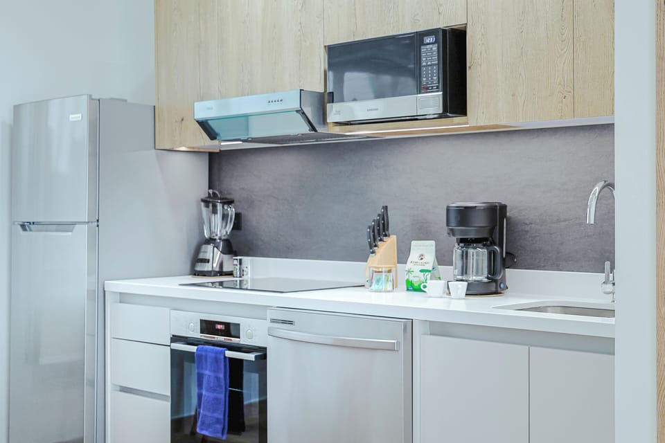 Your fully equipped modern kitchen makes meal prep a breeze, with sleek appliances and plenty of counter space to whip up anything from morning coffee to family dinners.