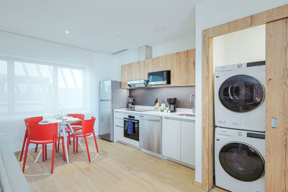 Your fully equipped kitchen makes self-catering a breeze, with modern appliances, sleek counters, and in-unit washer and dryer so you can pack light and stay fresh.