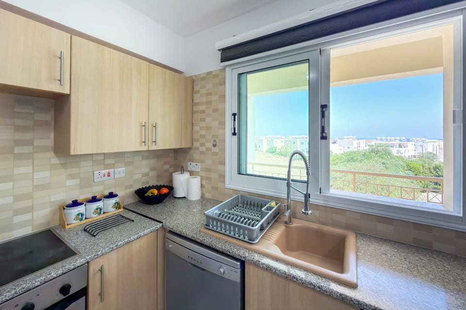 Apartment, Balcony, Pool View | Private kitchen