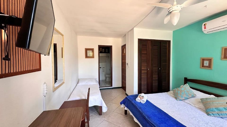 Triple Room, Lanai | Blackout drapes, iron/ironing board (on request), WiFi (free)