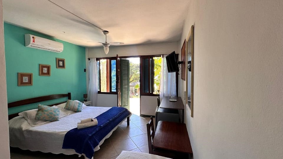 Triple Room, Lanai | Blackout drapes, iron/ironing board (on request), WiFi (free)