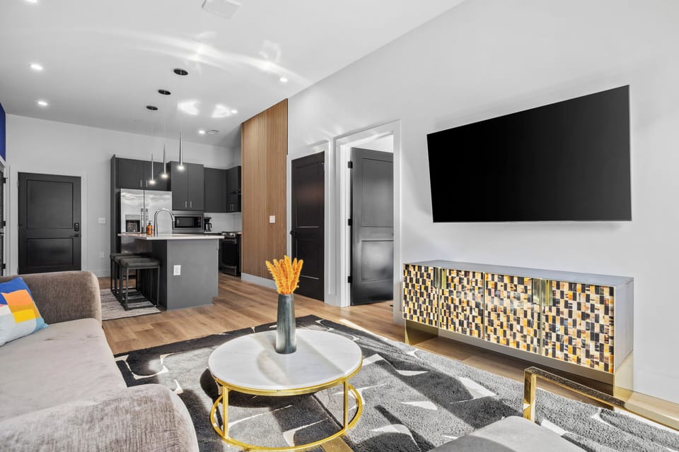 Spacious living area with Smart TV and modern open layout