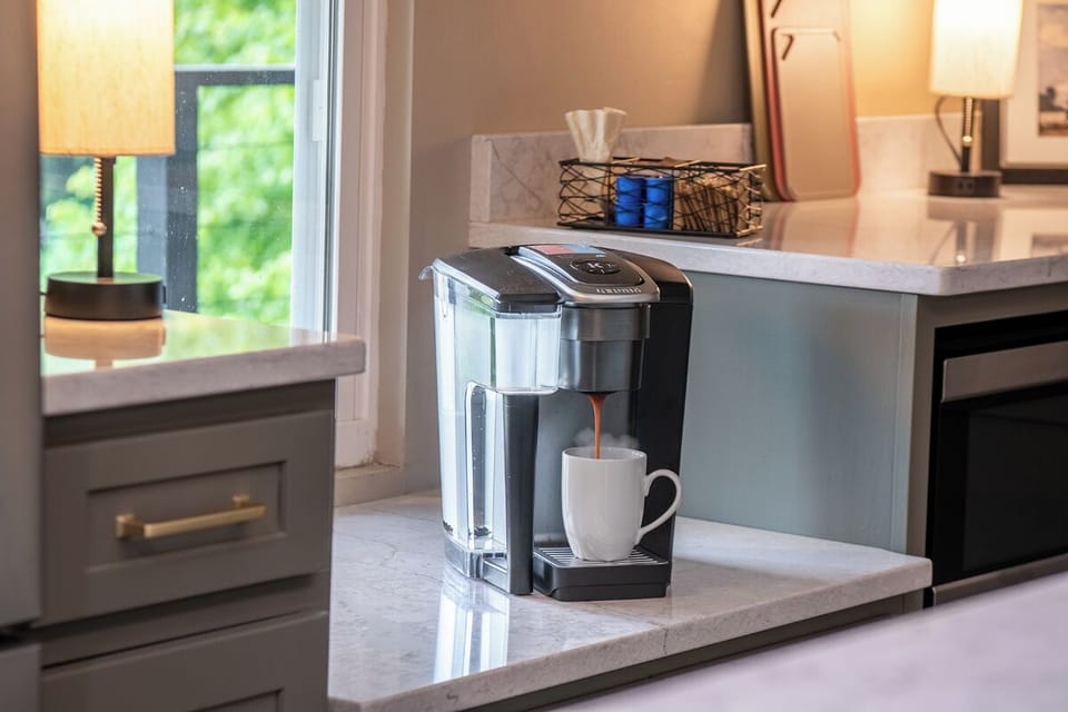 Start your mornings right with a fresh cup of coffee from your own in-room coffee maker, perfectly positioned by the window to catch natural light as you plan your day.