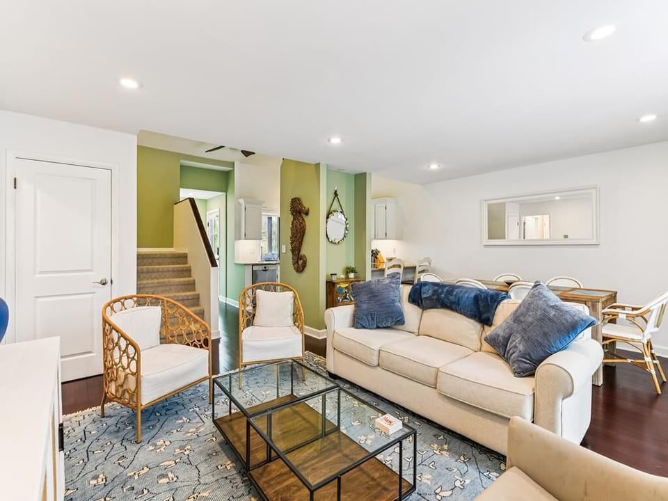 Bright living space with natural light -- great for family game nights and beach day plans