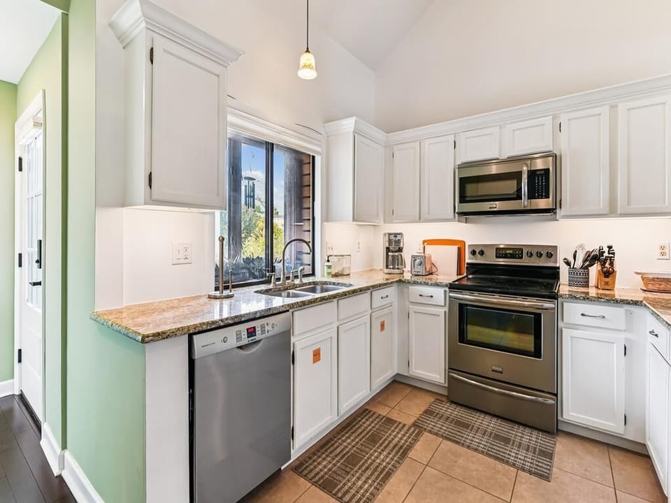 Cook up your favorites in this airy kitchen with full appliances and plenty of counter space