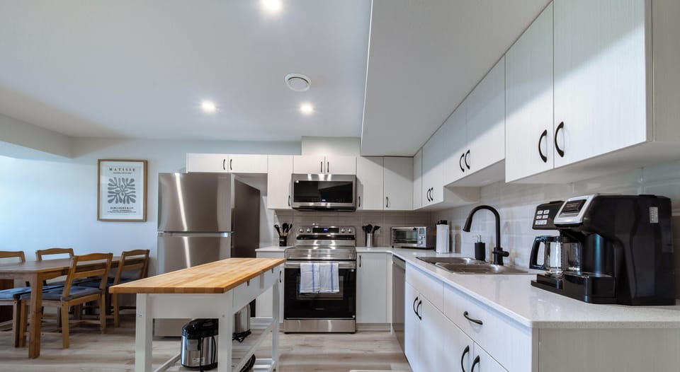Quartz counters with coffee maker and full-size sink