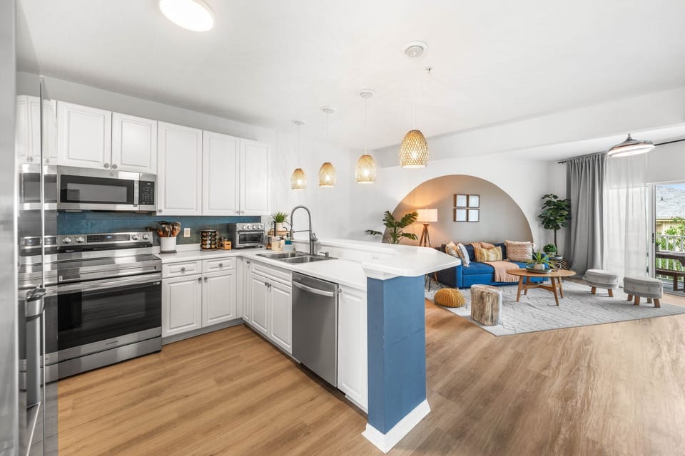 Bright open kitchen and cozy living area with stylish modern finishes