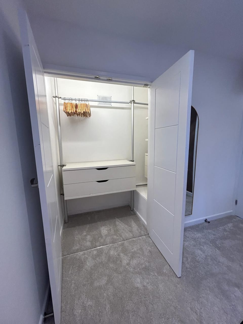 Plush zip & link bed that can be set up as king-size bed or 2 single beds, with premium linens, bedside tables with lamps, and elegant décor, creating a warm and relaxing retreat for a restful night's sleep.