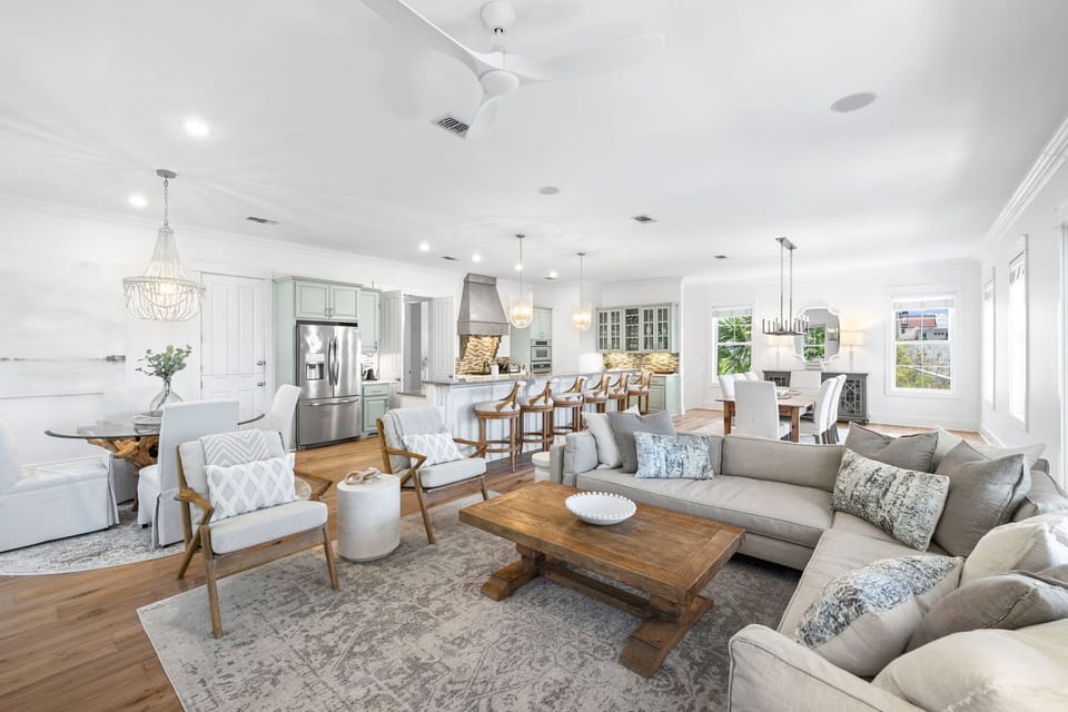 Settle into your elegant open-concept living space where coastal charm meets modern comfort, perfect for gathering with loved ones.