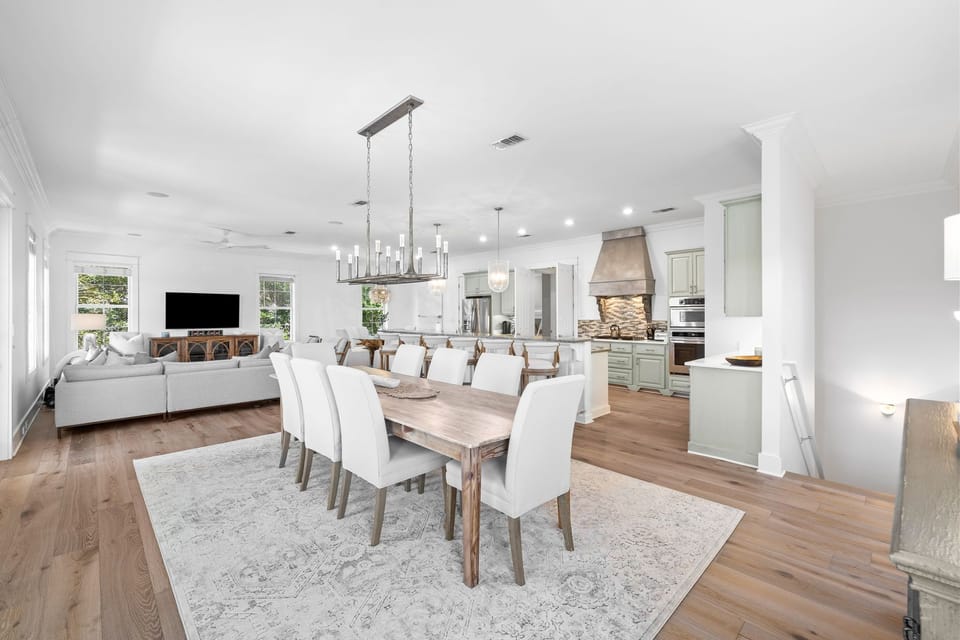 Gather your family around this elegant dining table in the bright, open-concept space that flows seamlessly into your fully equipped kitchen.