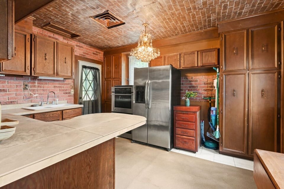 Kitchen | Stainless Steel Fridge | Chandelier Lighting