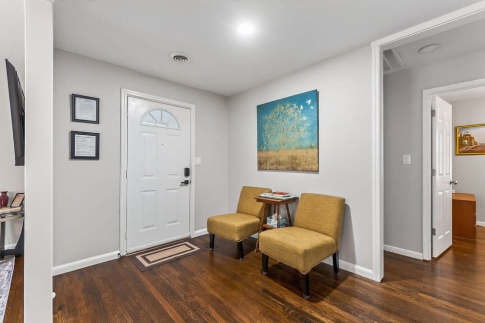 The welcoming front entry offers keyless access and a cozy pair of accent chairs for settling in.