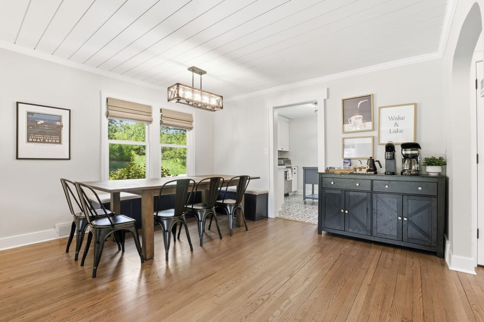 Reclaimed wood dining table with built-in bench comfortably seats 10. Additional folding table for 4 and chairs are available, so a large group can eat together.