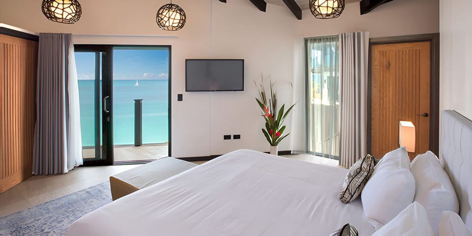 Unwind in bright, airy comfort with balcony breezes.