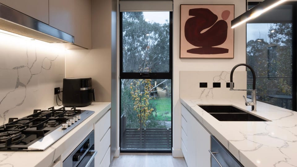 Modern kitchen with quality appliances and plenty of bench space.
