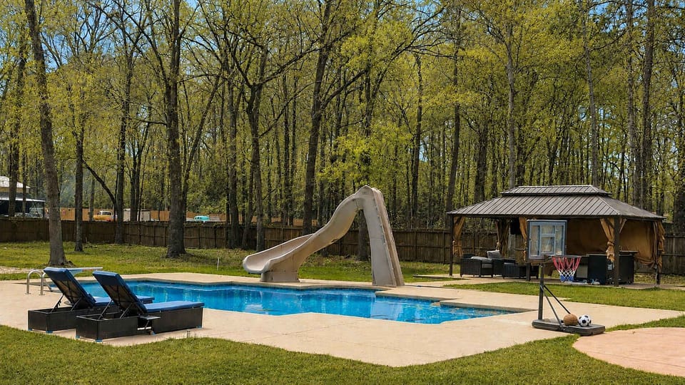 Your vacation just got a whole lot cooler! Dive into your own backyard escape, where sunny days, refreshing swims, and maximum “I’m never leaving this pool” energy await.