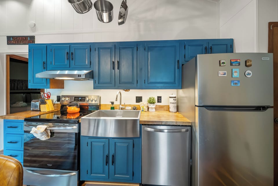 Stainless Appliances and Apron Sink in the Kitchen