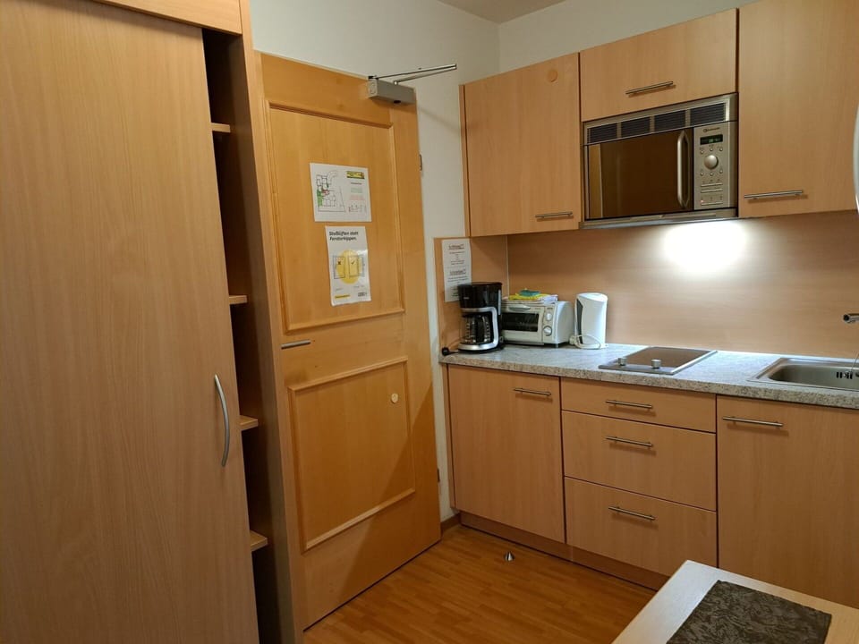 Cabinetry, Property, Kitchen Appliance, Home Appliance, Building, Kitchen Stove, Countertop, Wood, Interior Design, Drawer