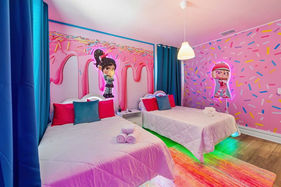 Sweet and playful twin bedroom with candy-inspired decor, glowing neon accents, and colorful touches that make this room feel like a fun dream getaway.