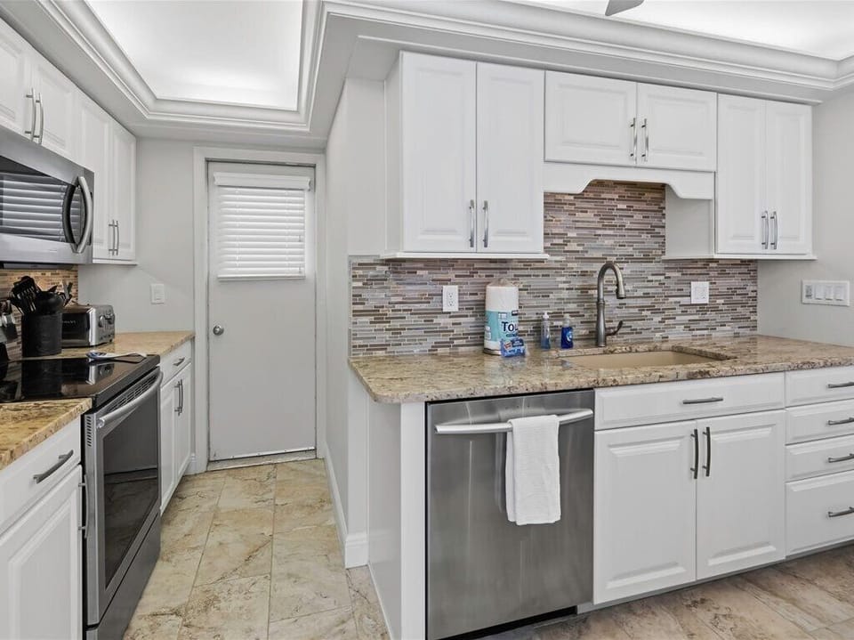 Kitchen with access to front private city view balcony