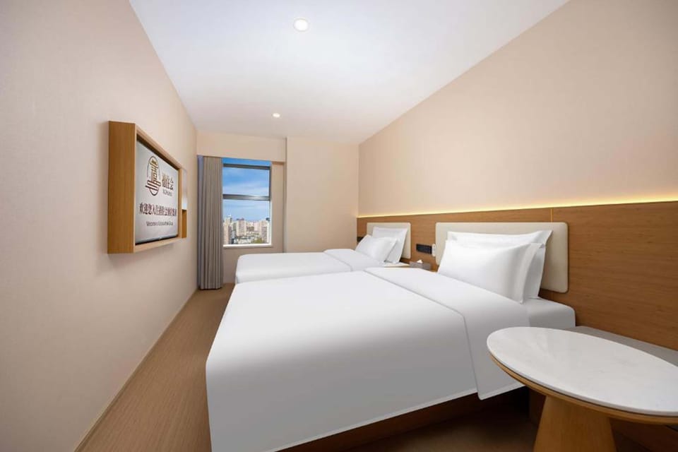 Business Twin Room, City View | Living area | 50-inch TV with cable channels