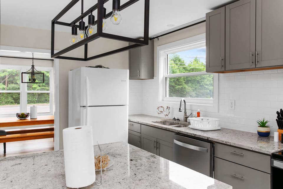 Move easily from prep to plate in this well-equipped kitchen—complete with granite counters, modern appliances, and everything you need for home-cooked meals.