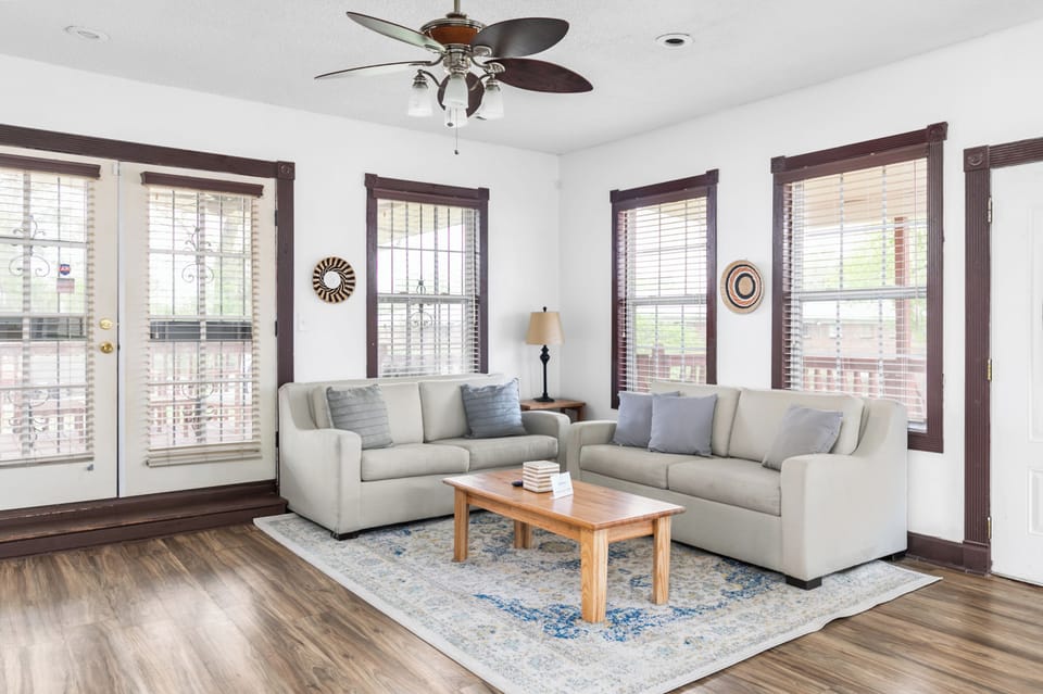 Comfortable seating invites everyone to settle in, with an open layout that keeps the living and dining spaces connected and easy to move between.