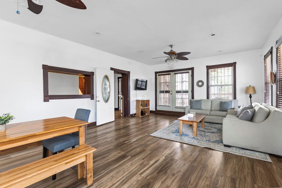 Front dining space sits just off the living room, offering an easy flow for meals and conversation. Open layout keeps everyone connected while still giving the area its own defined feel.