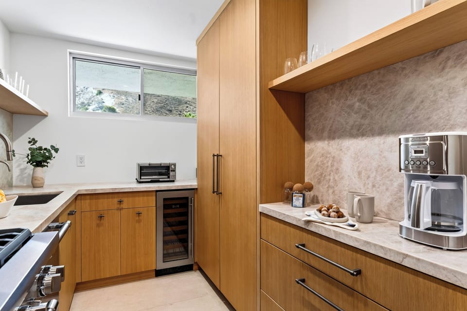 Functional kitchen with generous cabinetry and preparation space.