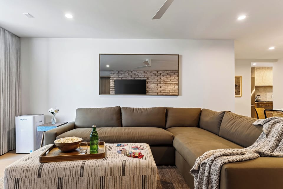 Cozy living area with comfortable seating and natural light.