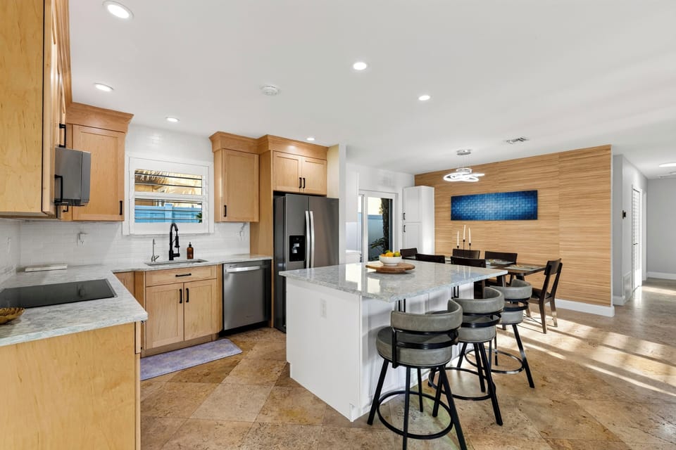 Spacious kitchen featuring stainless steel appliances.