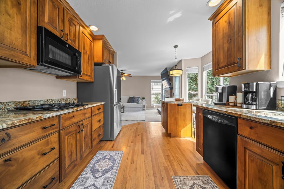 Spacious kitchen with everything needed to prepare meals comfortably throughout your stay.