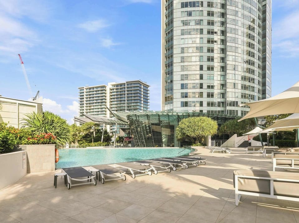 Resort style pool and sun lounge area for laid-back Gold Coast days