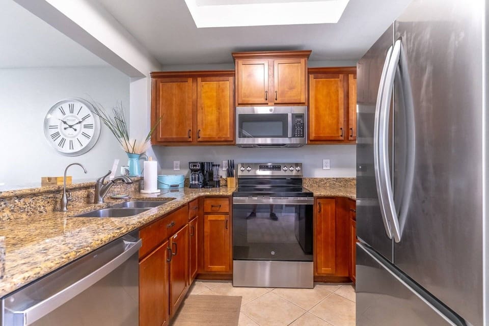 Fully Equipped Kitchen with granite counters and stainless steel appliances (second floor)