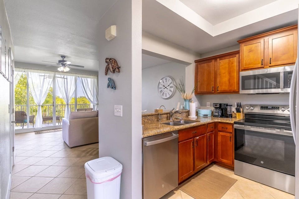 Fully Equipped Kitchen with granite counters and stainless steel appliances (second floor)