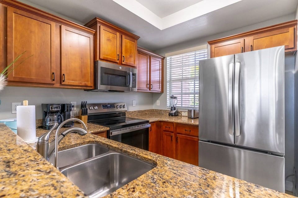 Fully Equipped Kitchen with granite counters and stainless steel appliances (second floor)