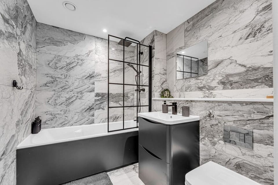 A clean and modern bathroom with all the essentials to help you feel refreshed and comfortable throughout your stay. (Rich Property Management)
