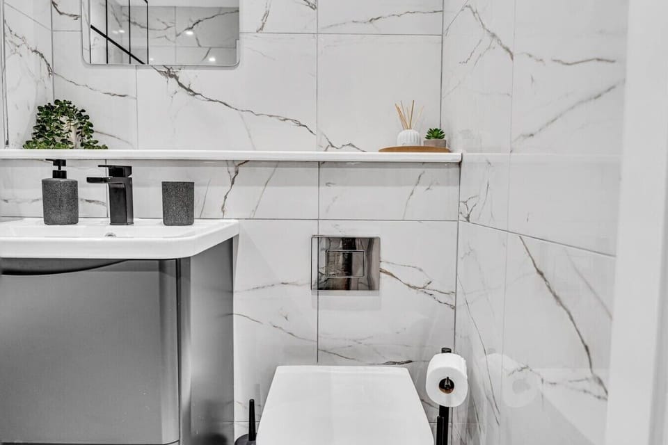 A clean and modern bathroom with all the essentials to help you feel refreshed and comfortable throughout your stay. (Rich Property Management)
