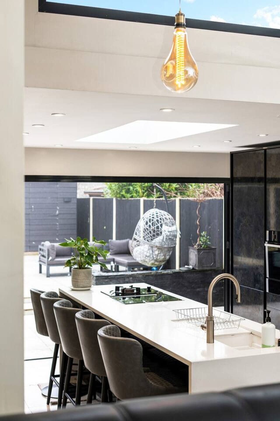 A clean and contemporary bathroom sink area with modern fixtures and plenty of natural light. (Rich Property Management)