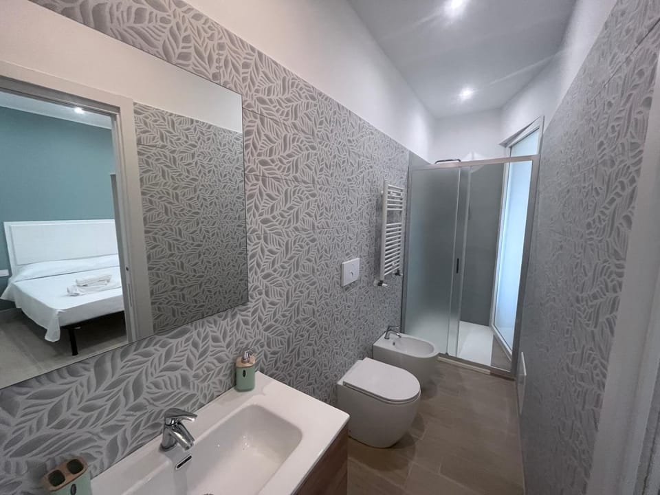 Family Quadruple Room | Bathroom | Hair dryer, towels, soap, toilet paper