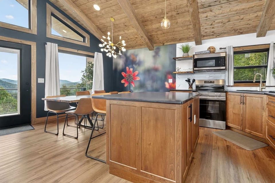 Our fully stocked kitchen is next to the dining room and living room. This is perfect to keep the conversations flowing while cooking your favorite meal or making a great cup of coffee.