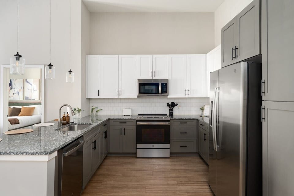 Spacious kitchen area with 4 counter stools