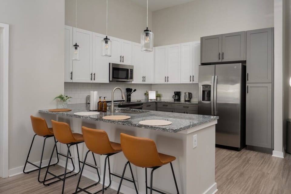 Spacious kitchen area with 4 counter stools
