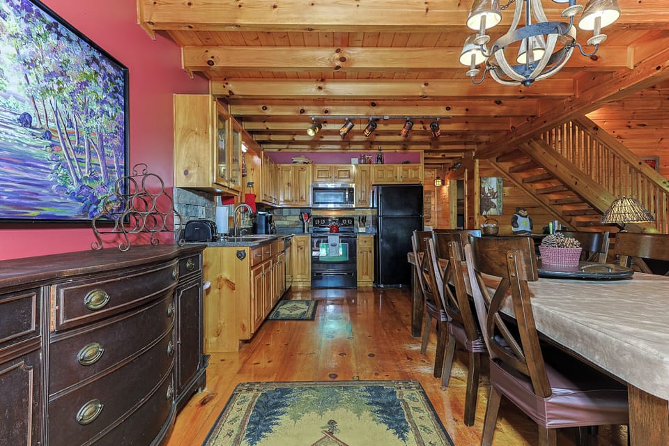 The kitchen and dining area offer plenty of room for meals, games, and conversation