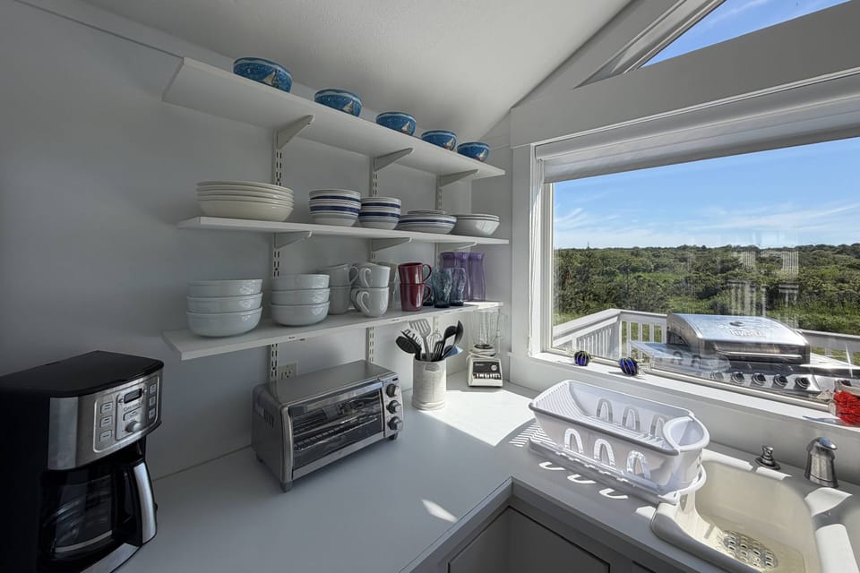 Fully stocked kitchen overlooking the marsh